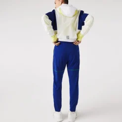 Lacoste Sport Zip Pockets Tapered Tracksuit Bottoms in Multi colour