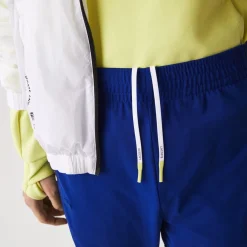 Lacoste Sport Zip Pockets Tapered Tracksuit Bottoms in Multi colour