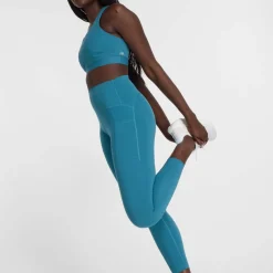 New Balance Sleek Medium Support Pocket Sports Bra in Blue